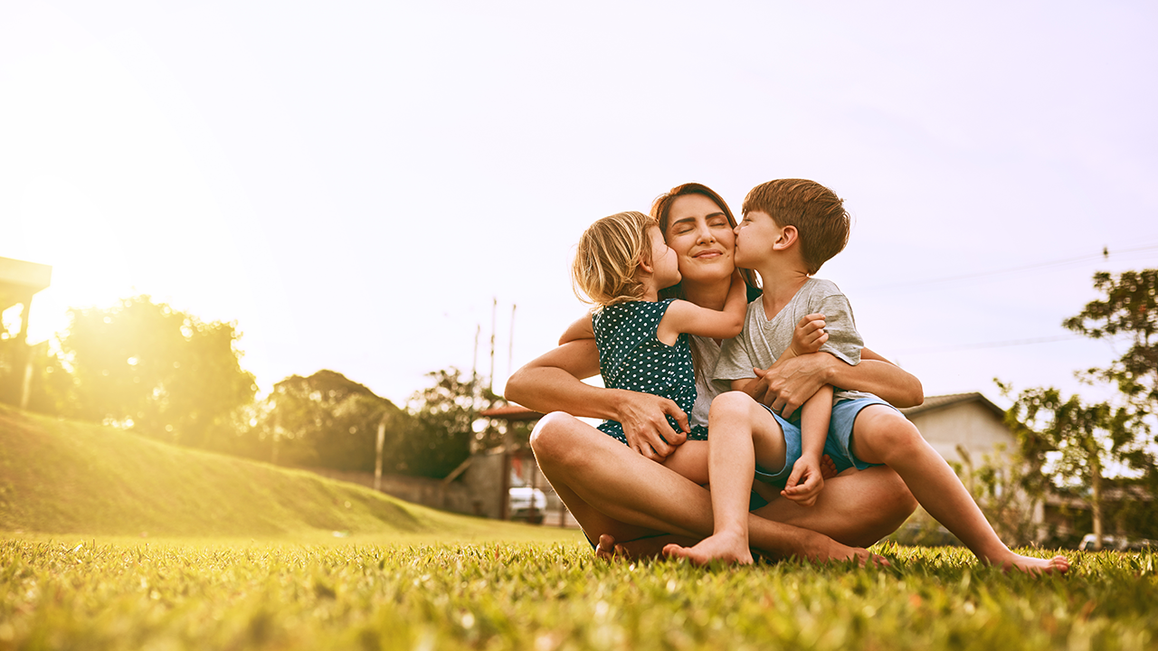 mother with children in a sunny field
